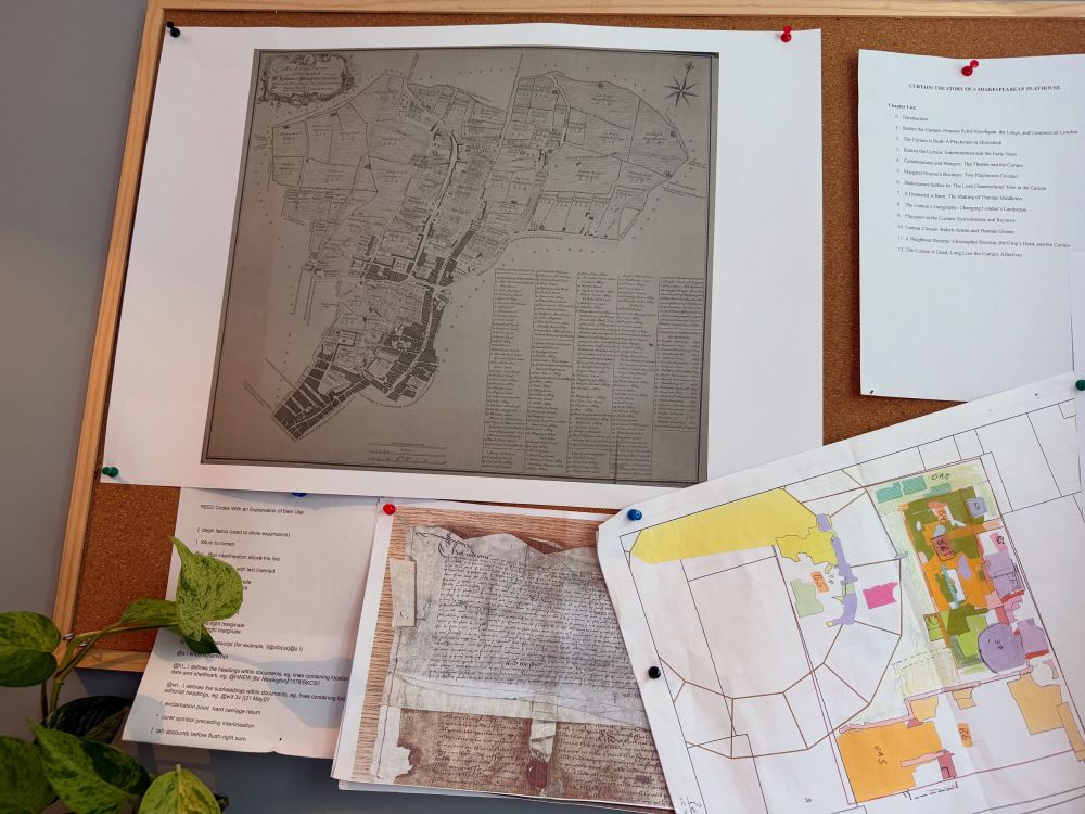 Corkboard wirh map, documents, a photo of a manuscript with seal, and coloured groundplans