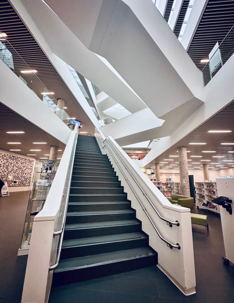 Cool architecture in a library with freaky steps and neat geometries 