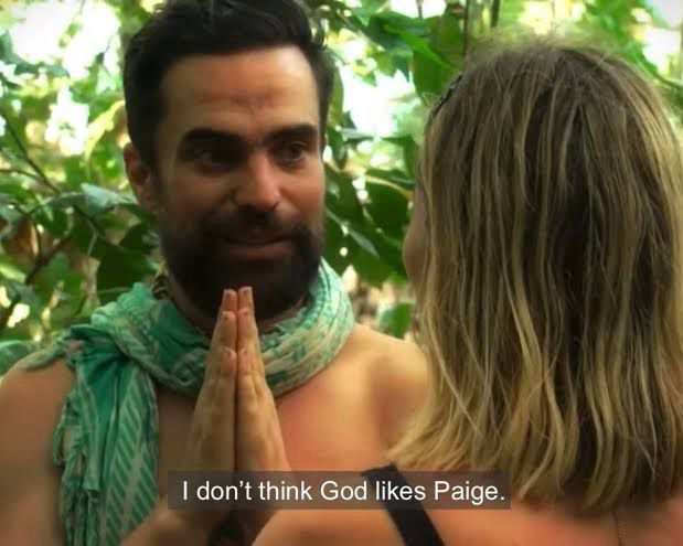 Picture of George in Australian Survivor saying “I don’t think God likes Paige”. 