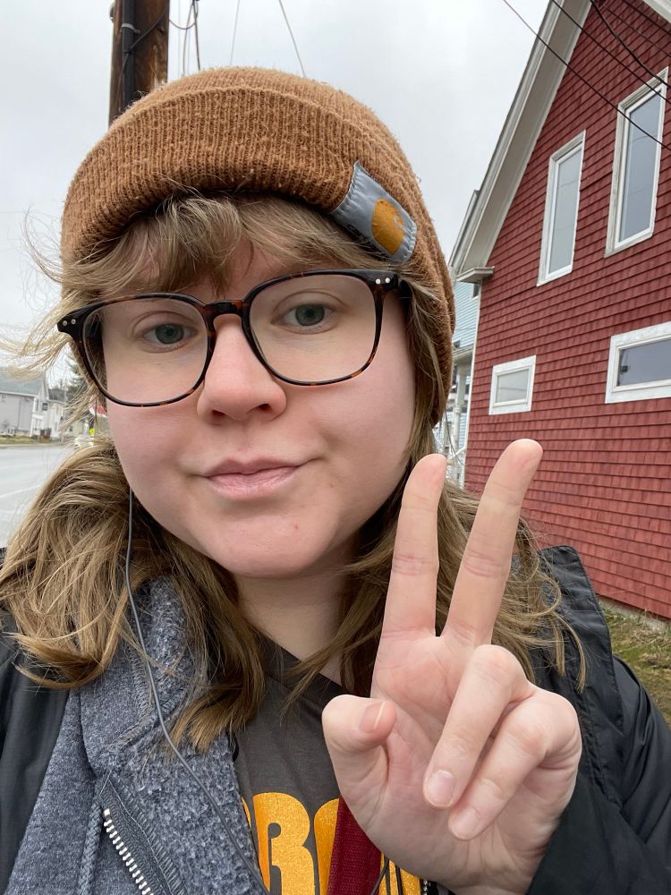 Selfie of me in my yellow carharrt being putting up a peace sign 