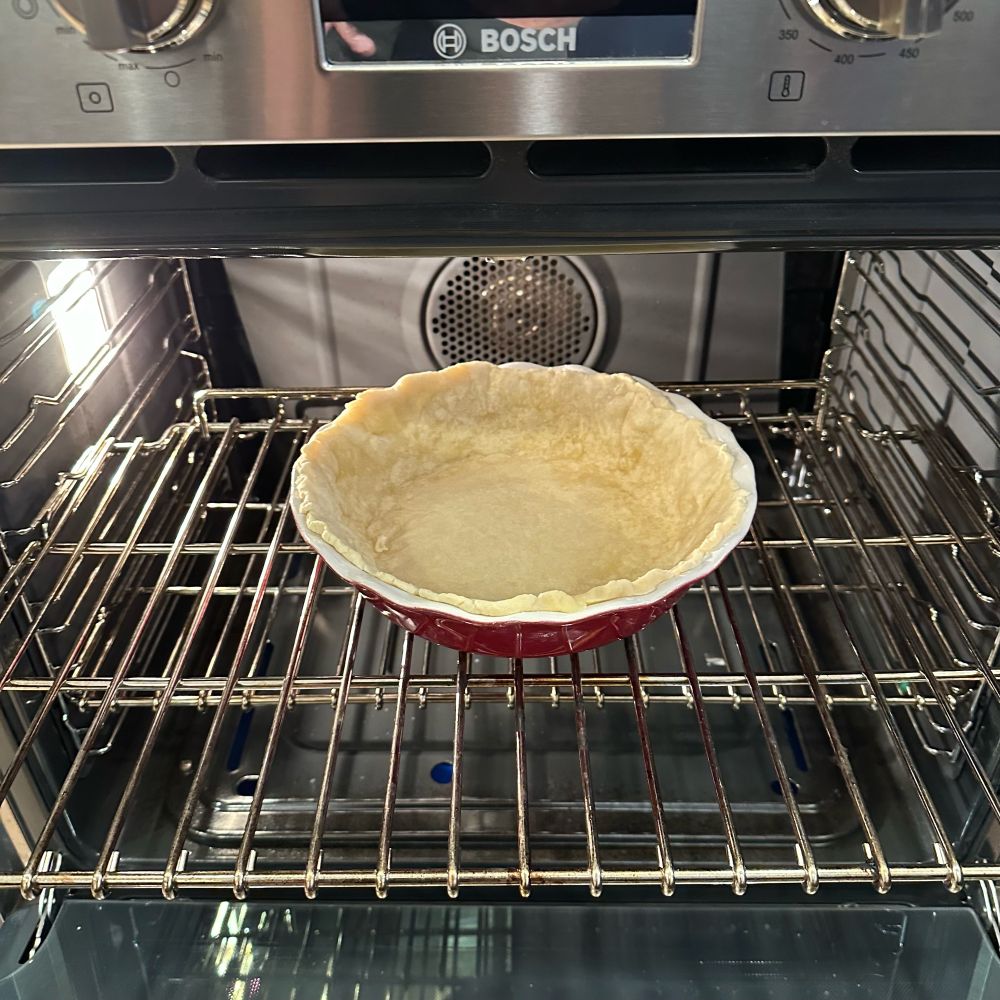 Scratch made dough in an oven for a quiche. 
