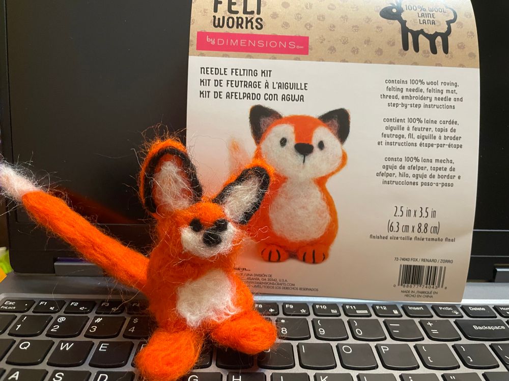a poorly needle felted fox, it looks more like a kangaroo mouse. behind it is a picture of what it should look like. they are very different