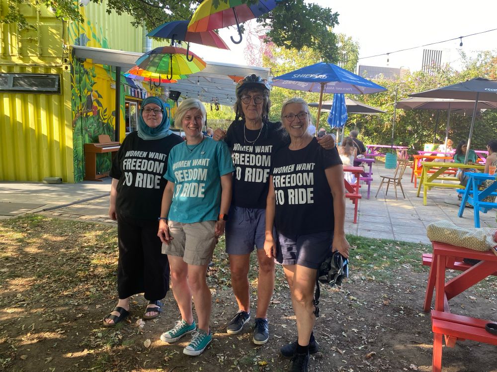 4 women wearing Women want freedom to ride'. T-shirts 