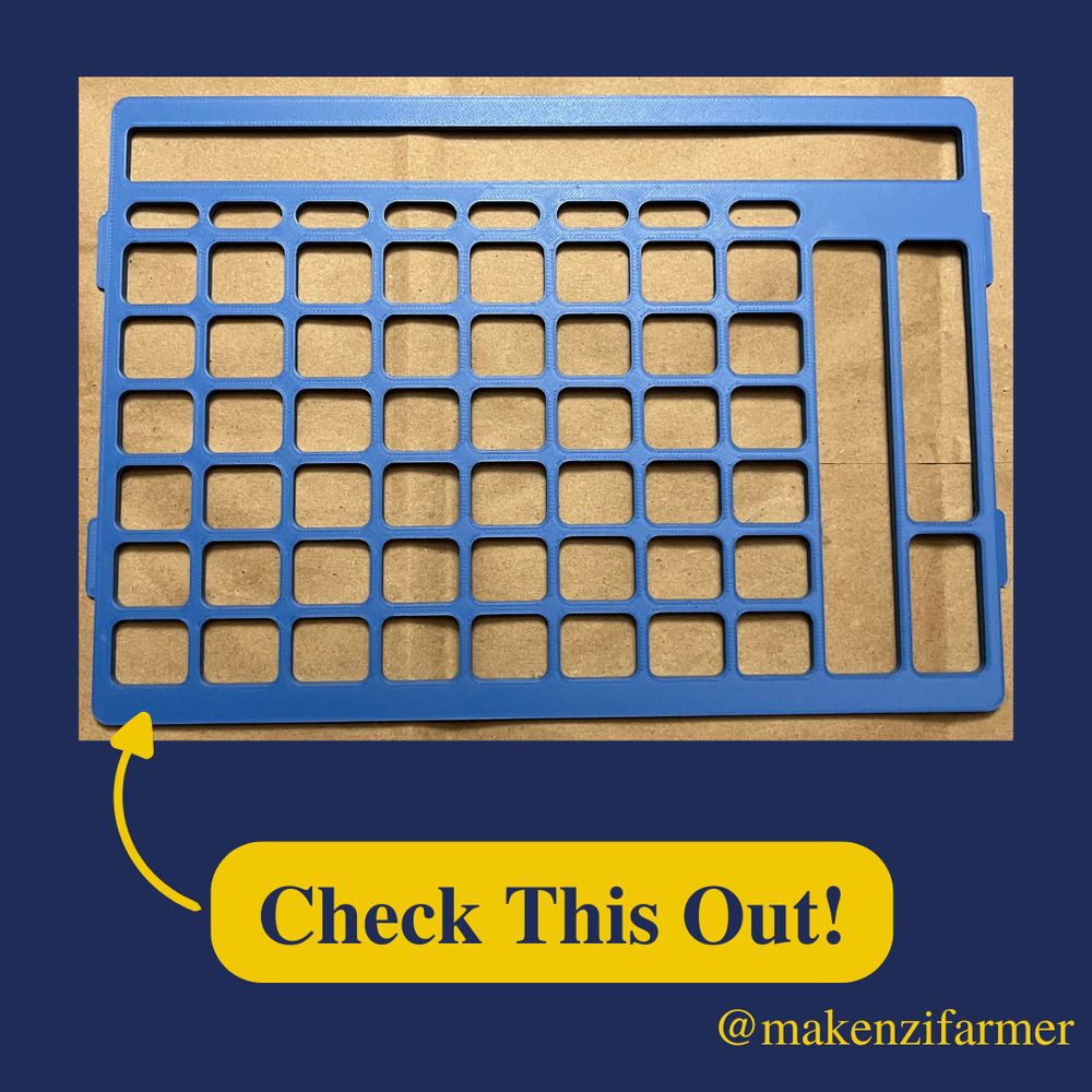 A blue plastic keyguard with a grid of 8x6 with some additional openings at the bottom and right side on a brown background. The background is blue with a yellow speech bubble that reads, “check this out!”. “@makenzifarmer” is displayed in the bottom right corner. 