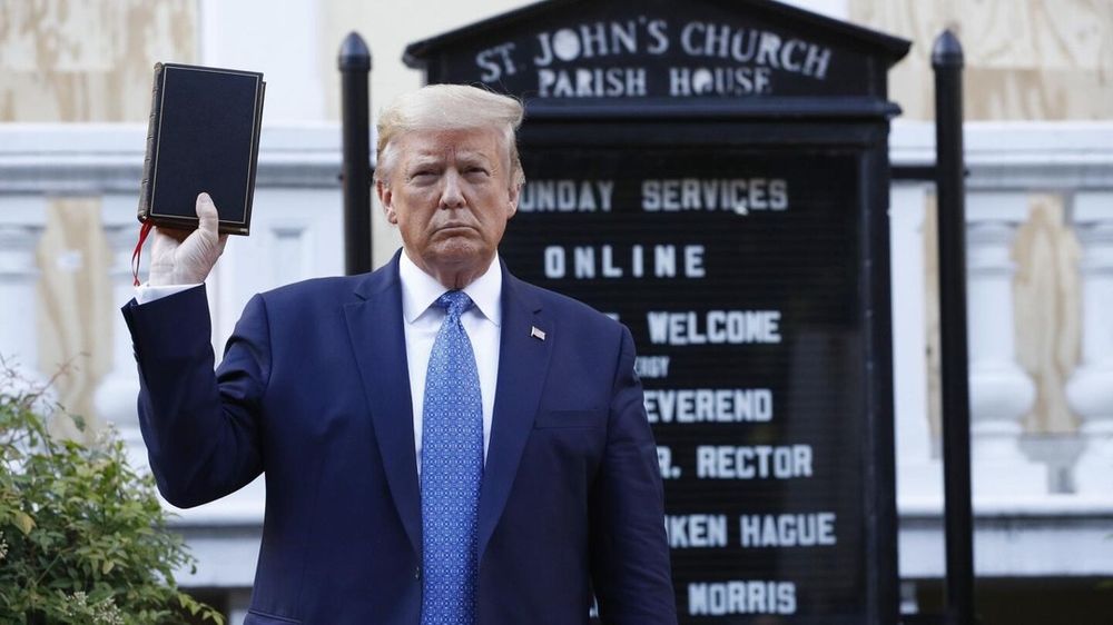 Former President Donald Trump holds up a Bible outside St. John's Episcopal Church near the White House after it was damaged during protests. This symbolic gesture followed the dispersal of protesters from the area, sparking widespread reactions and discussions on the use of force and the role of symbolism in leadership.