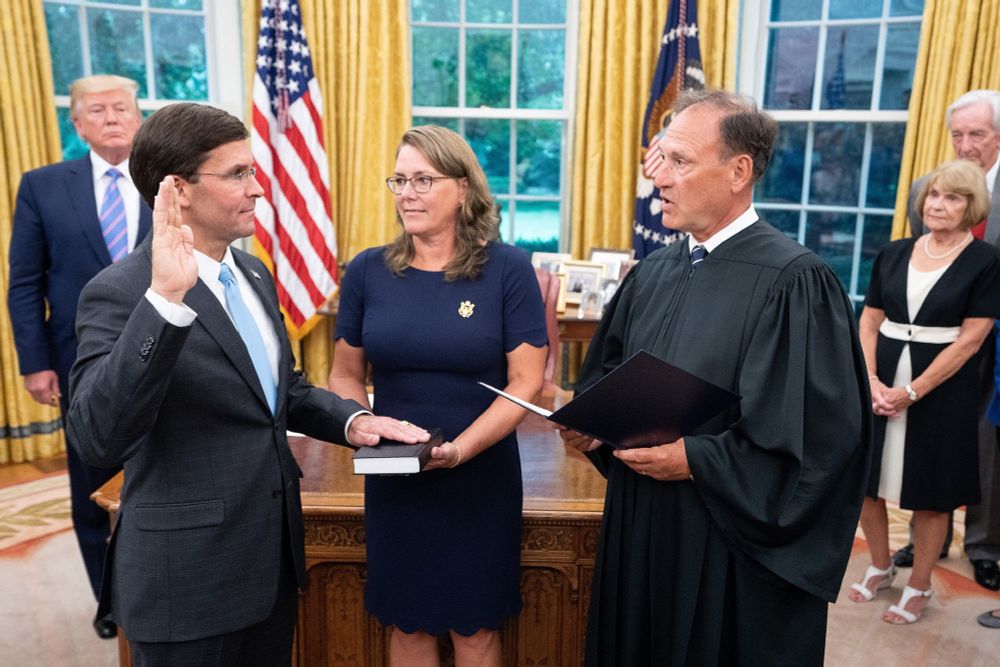Esper, with his wife Leah, is sworn in as Secretary of Defense by Justice Samuel Alito on July 23, 2019.