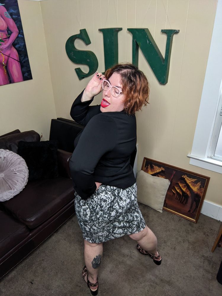 This photo shows Gwynne turning slightly more away from the viewer and giving more dramatic face. The high key lighting makes the image poppy and bright. 