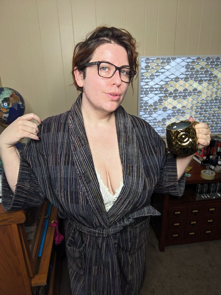 A photo of dominant Professor Gwynne in white lace lingerie and robe, large breasts pale and well moisturized. Her green eyes are framed with brown tortoiseshell glasses. They faze deeply into the viewer's soul. She is a red head, her wavy hair messy and voluminous this morning.  She is a hot teacher SW Content Creator. 


Skyhub domme 🧡🖤 🖤🧡