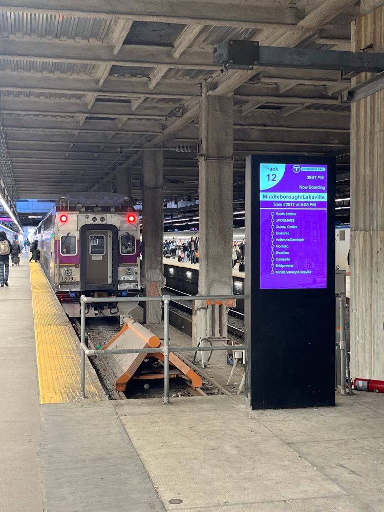 A commuter rail PED at South Station displaying a destination of "Middleborough/Lakeville"