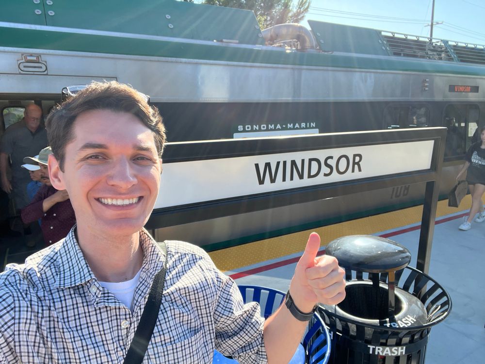 Jeff with the ceremonial "thumbs up" in front of a train on the Windsor station platform.