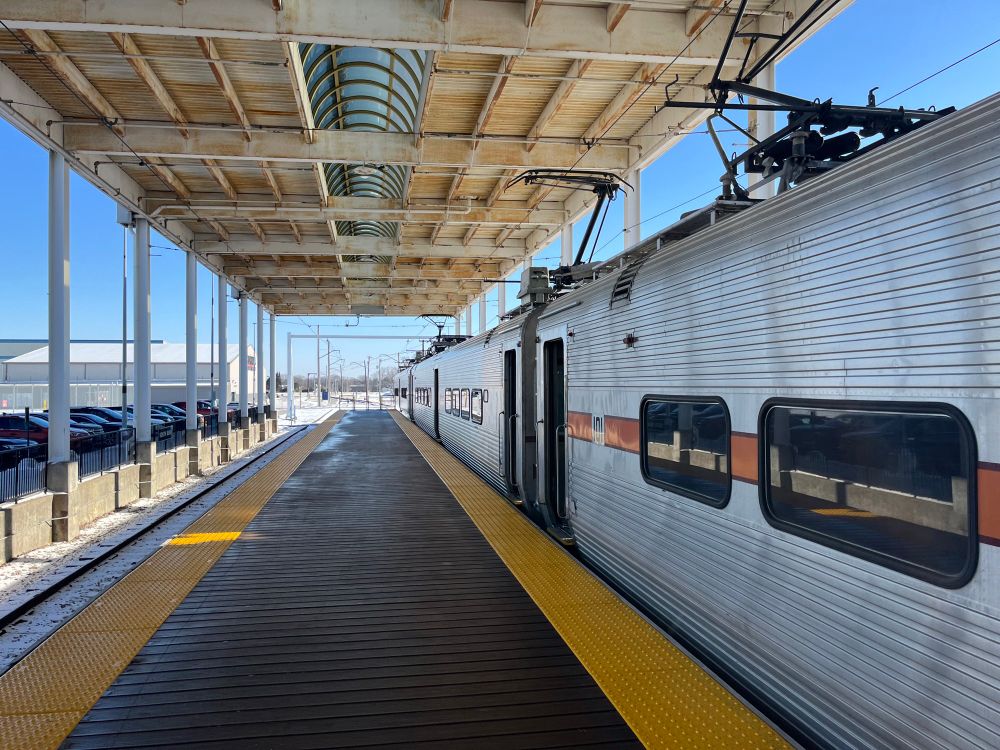 The South Shoreline EMU train adjacent to the island platform at the South Bend Airport station.