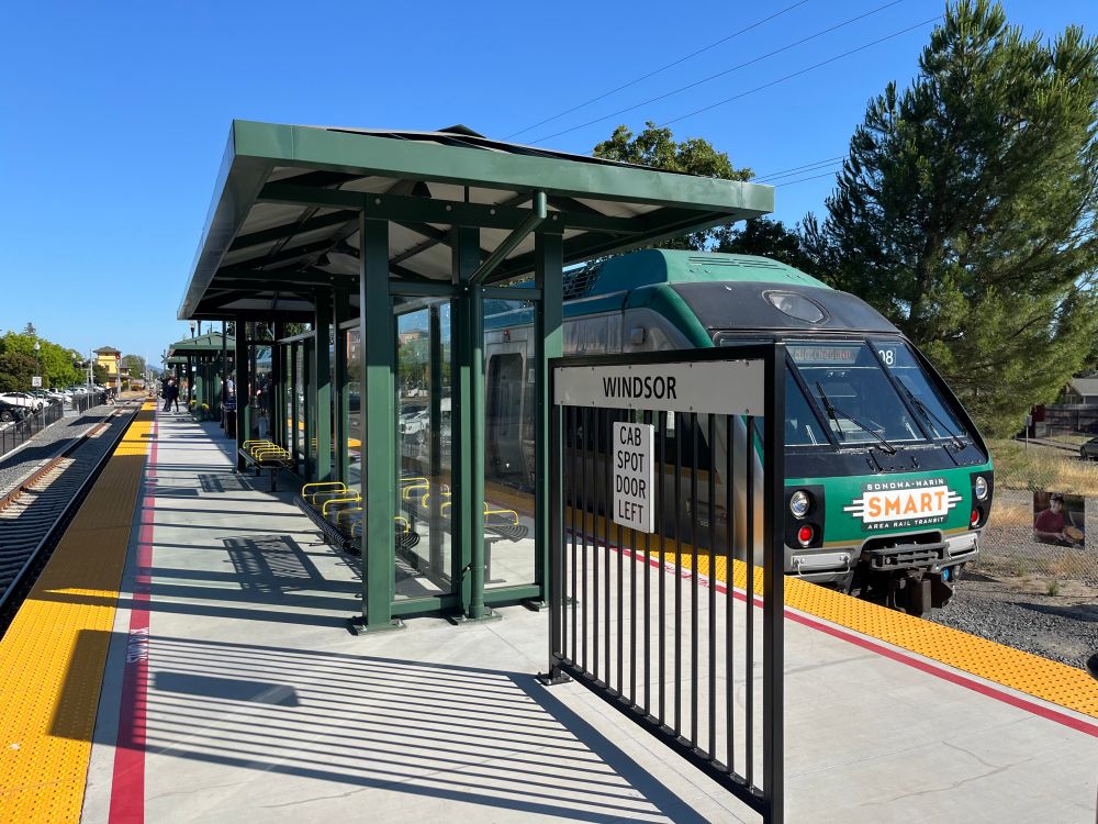 The Windsor station platform with a train in the background.