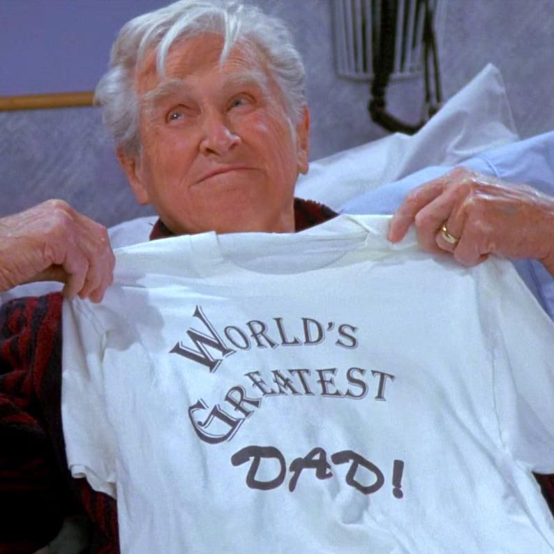 Izzy Mandelbaum holding the World's Greatest Dad! T-Shirt
