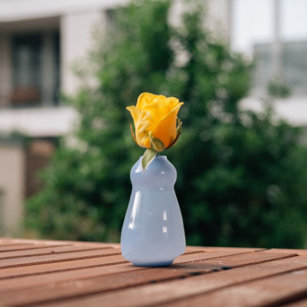 A conical vase with a floating foot and bulby top
