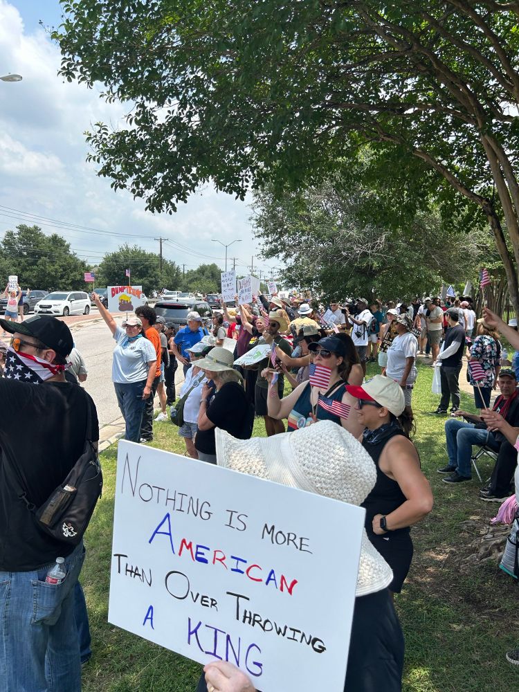 No Kings Rally in Pflugerville TX today, showing a large peaceful crowd