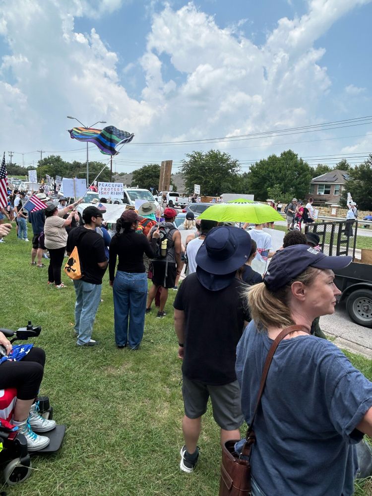 No Kings Rally in Pflugerville TX today, showing a large peaceful crowd