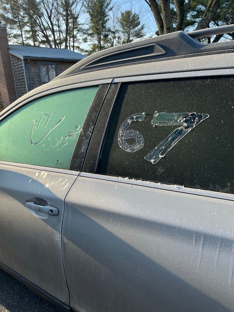 67 carved on the frost on my car window 