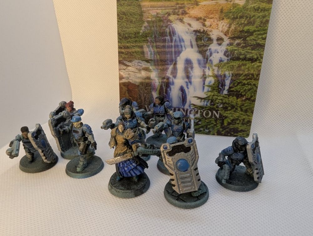 Several space cops, mostly with riot shields