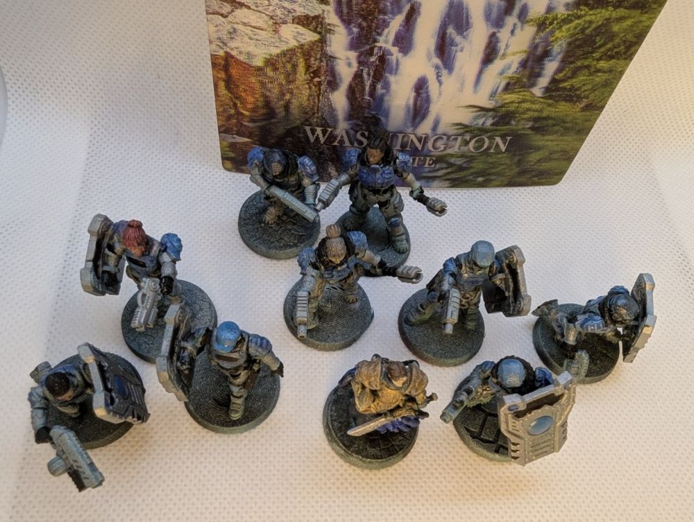 Several space cops, mostly with riot shields