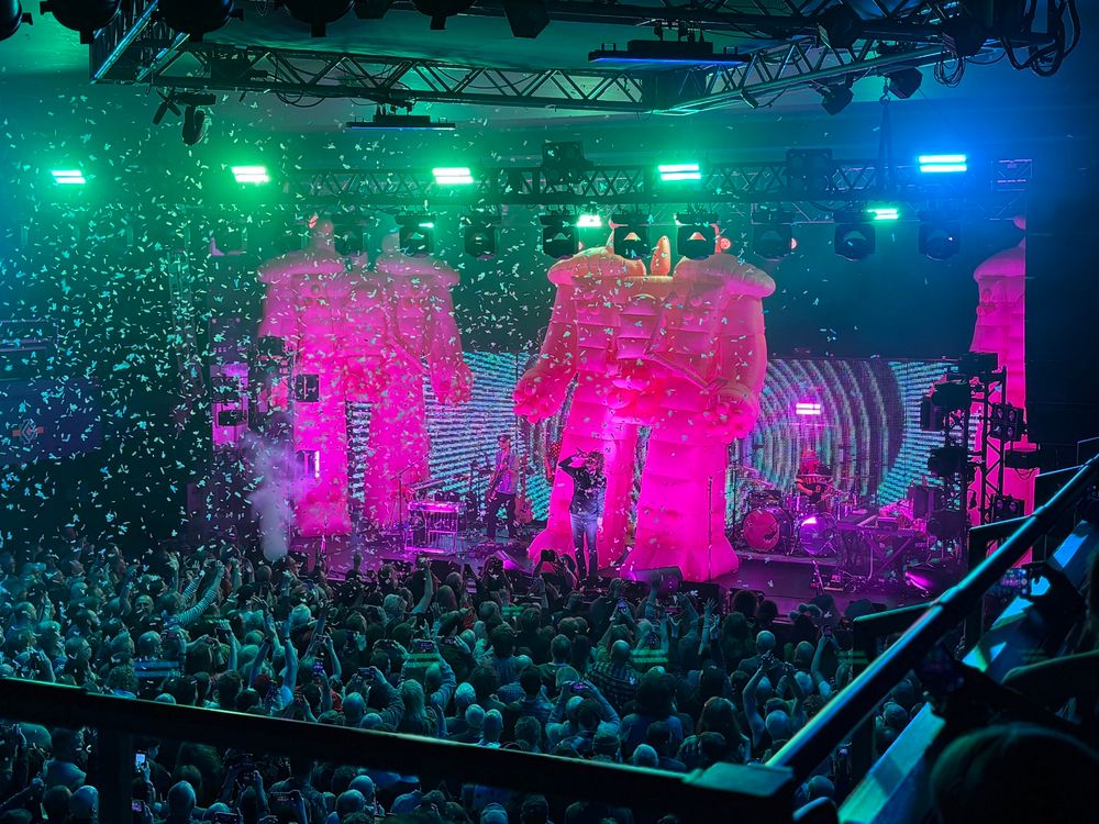 Wayne Coyne and some inflatable pink robots