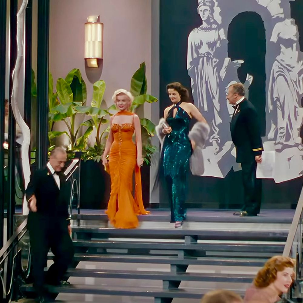 From the dinner scene, Marilyn Monroe & Jane Russell enter the grand dining hall of the cruise ship. They’re stopped at the top of a grand staircase, pausing in order to truly make an entrance. 