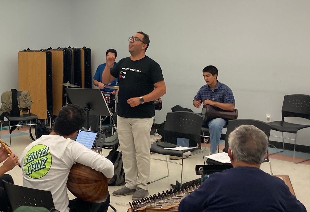 A group of people play music