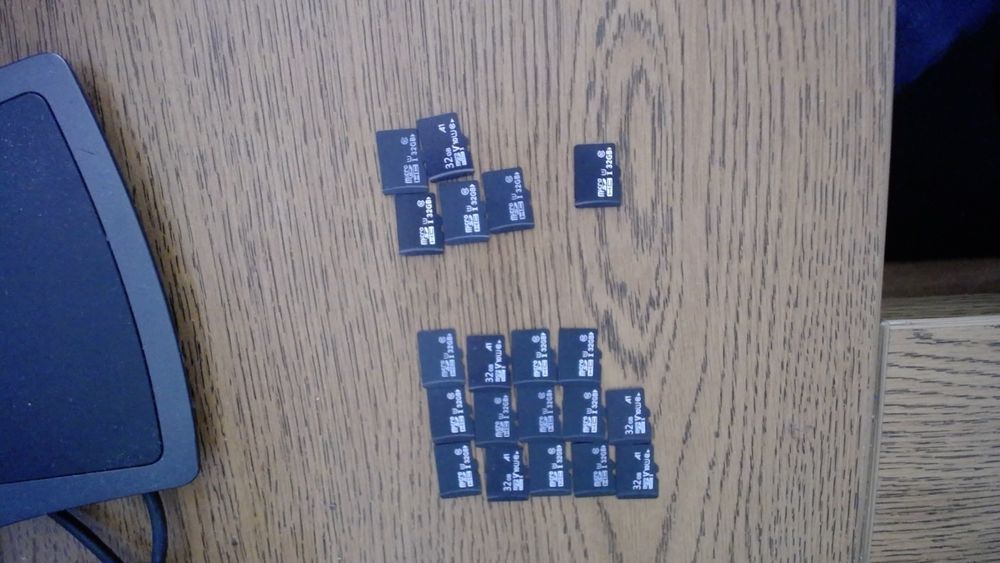 Twenty microSD cards, separated into groups of 15, 5 and 1.