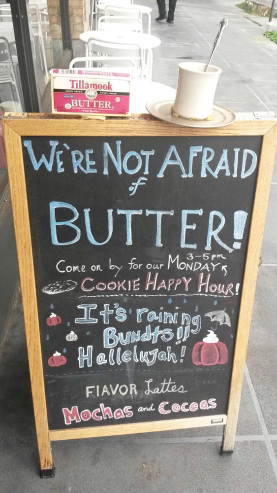 Sandwich board sign outside bakery says "We're not afraid of butter!"