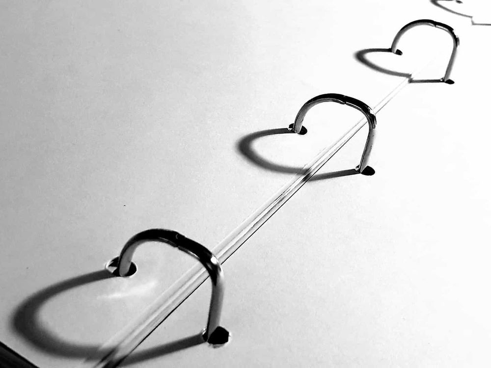 The light and shadows form a heart from the rings of a drawer