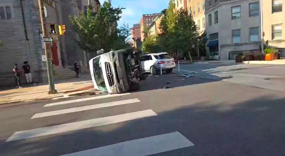 A van flipped over after being impacted by the driver of a mercedes
