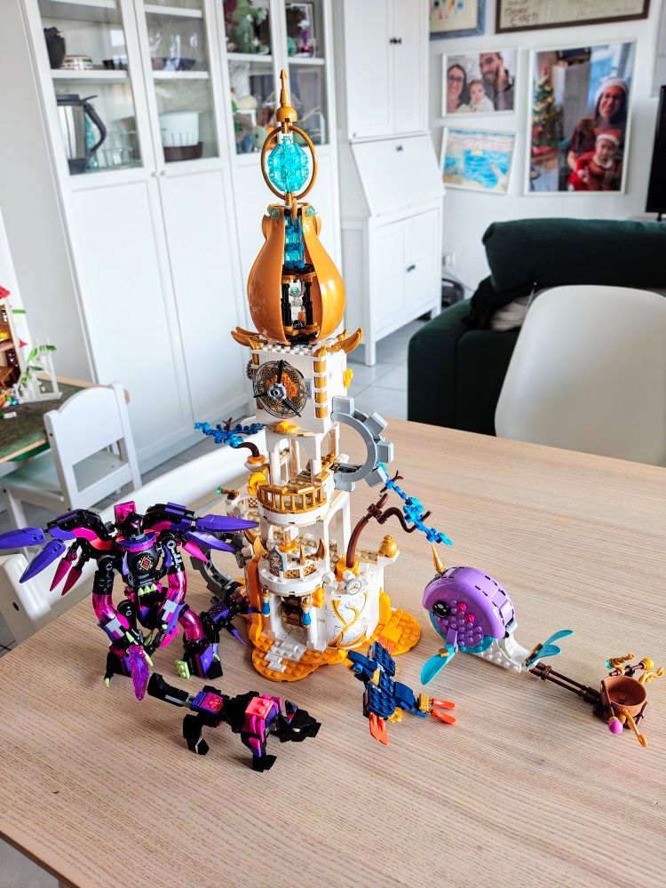 A picture of 3 fully built Lego set of the DreamZzz line. The kits are the sandman tower, the nightmare witch creatures, and the narwhal hot air balloon 
