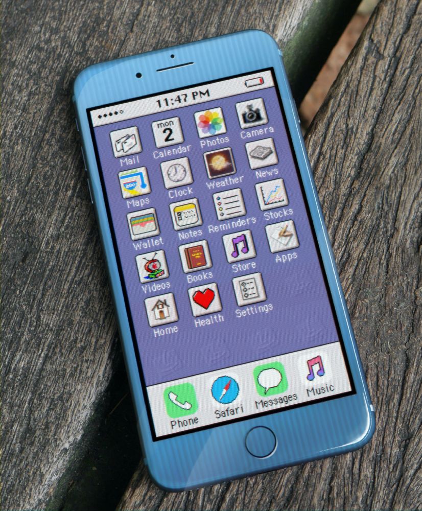 A picture of an iPhone on a wooden bench. The iPhone appears to be styled after a Power Macintosh G3 or G4, and the user interface looks a little bit too much late 1990s.