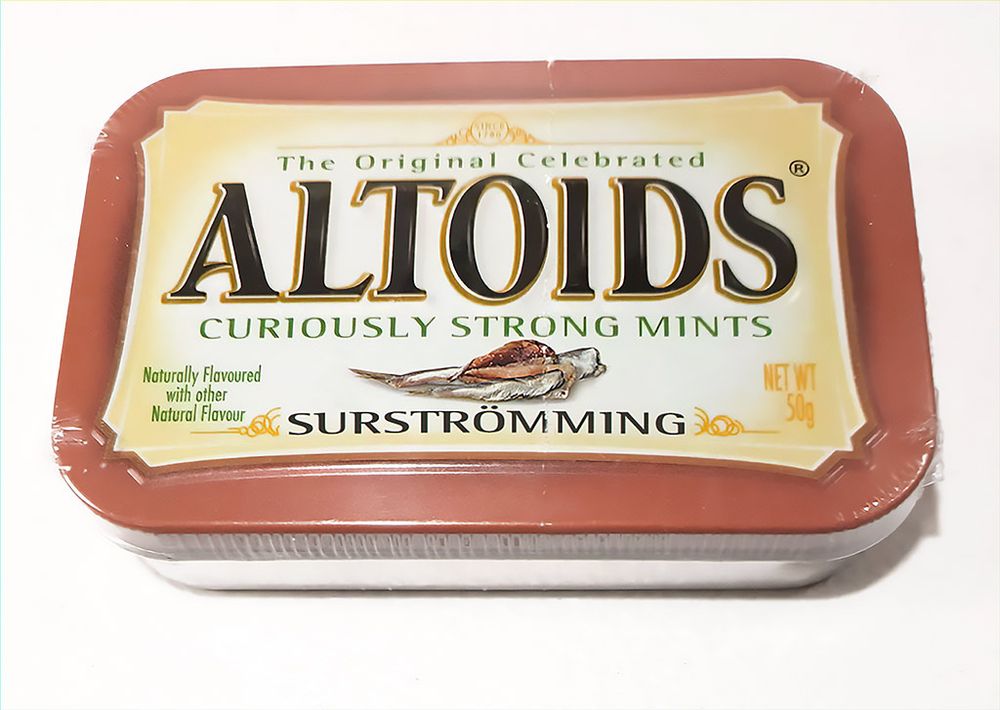 A picture of a tin of Surströmming flavour altoids against a white background. The package is still wrapped up.