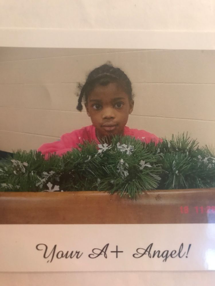 Childhood photo of a young Caprice that says Your A+ Angel