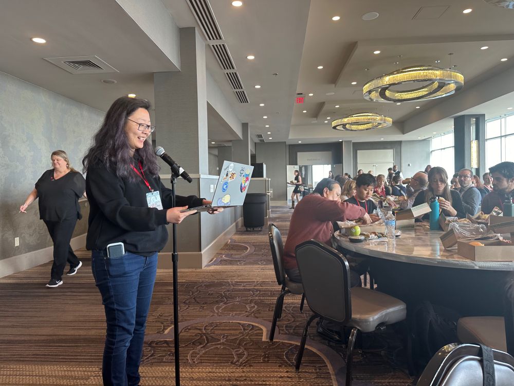 Woman speaking to large audience