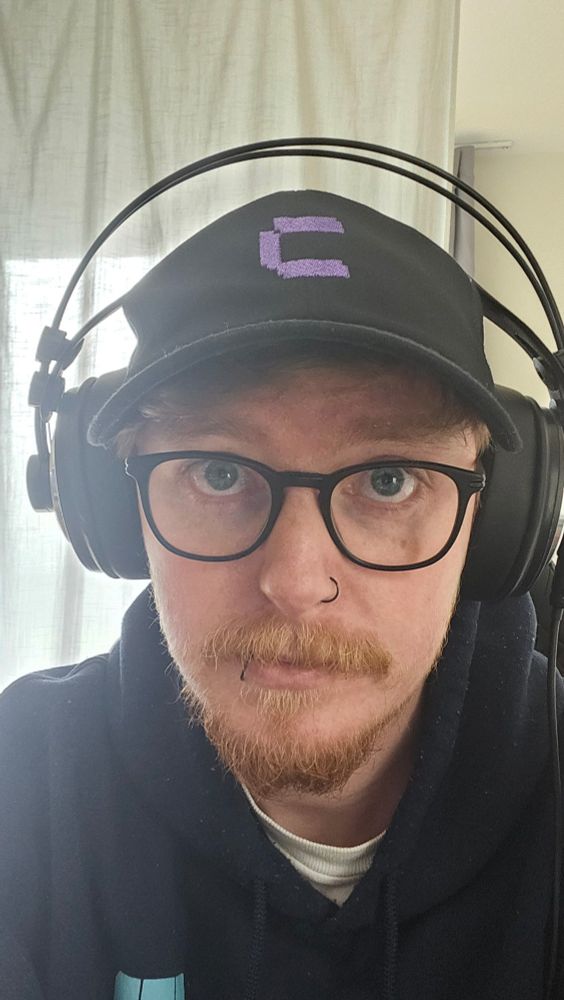 Selfie wearing a coolify hat