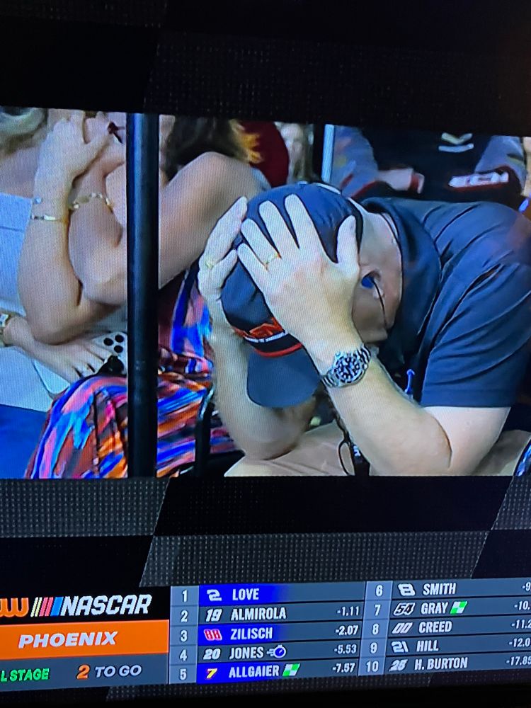 Jesse Love’s dad holding his head