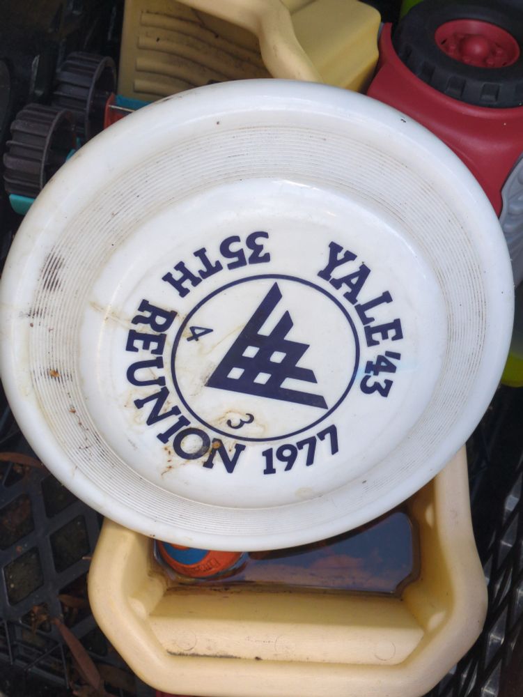 Frisbee that reads "Yale '43 35th reunion 1977"