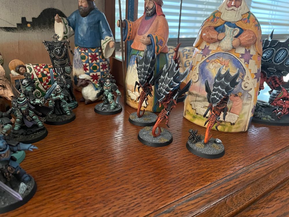 A trio of Tyranid Zoanthropes drift menacingly in front of the three wise men.