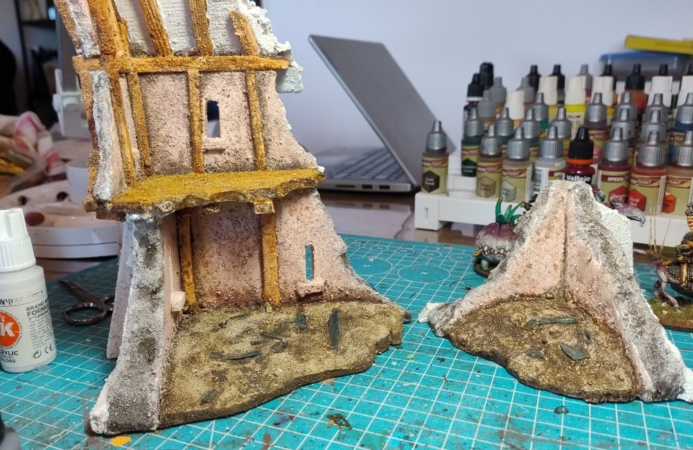 Model ruins for 28mm Wargaming. They are what's left of a wooden frame house. 