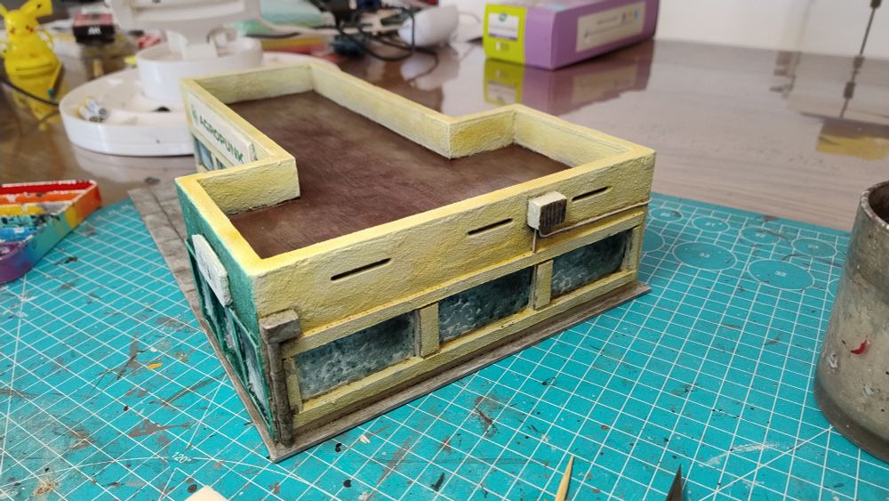Commercial building with stores, an MDF kit I pimped up for some Wargaming. 
