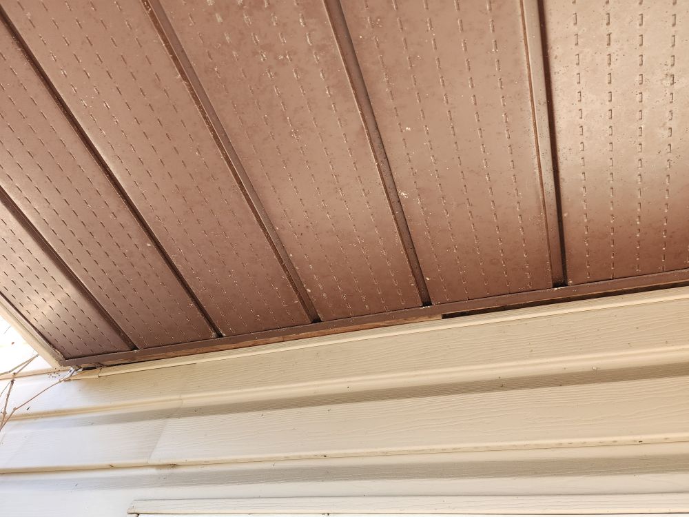 Photo of porch overhang and house.
