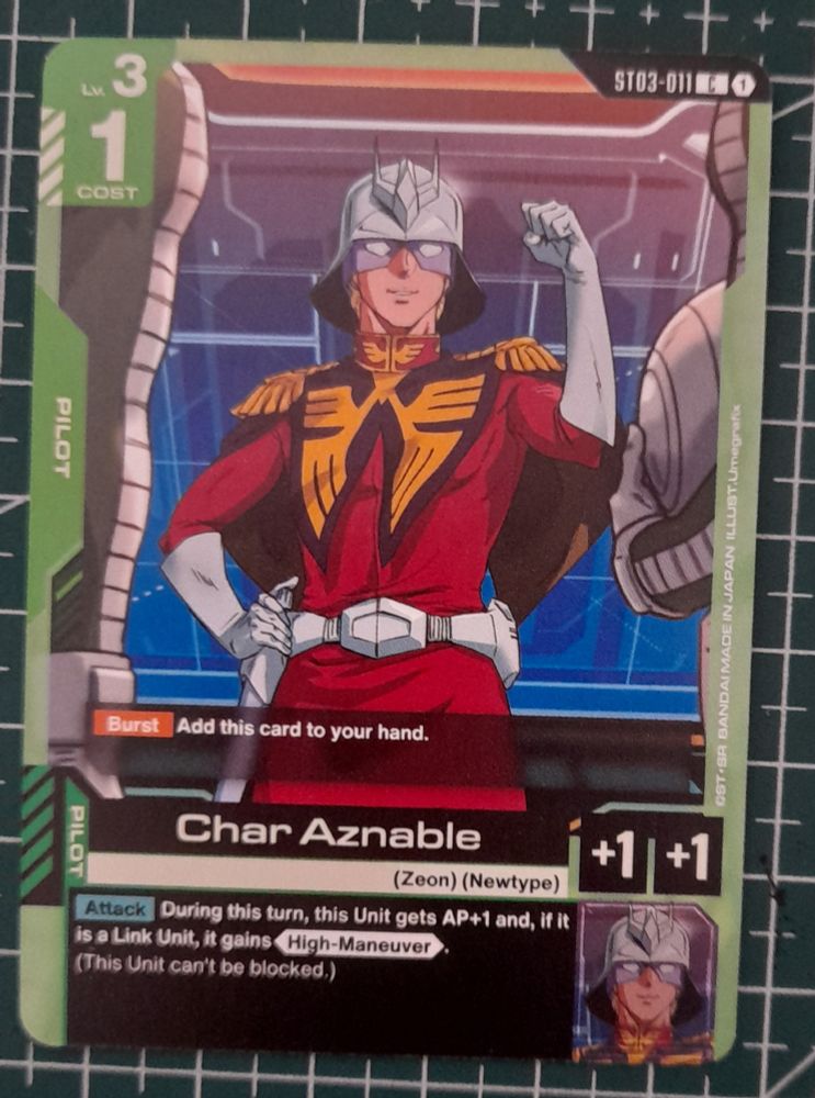 A photo of a Gundam TCG card featuring a very confident looking Ramba Char Aznable from “Mobile Suit Gundam” 
