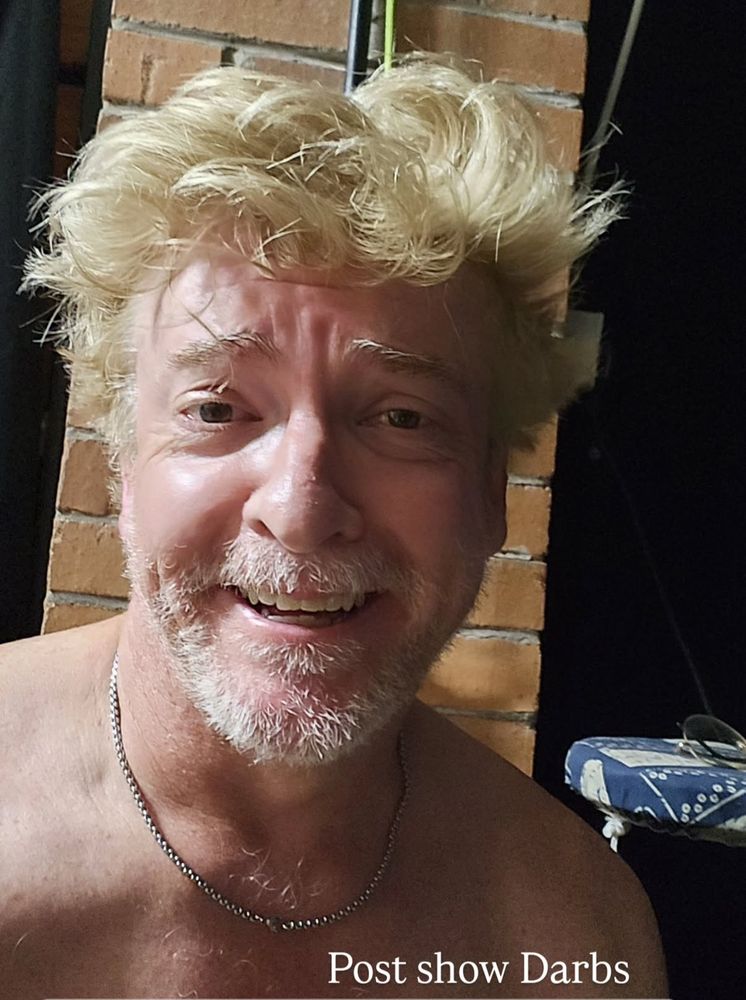 Rhys Darby shirtless selfie with a chain 