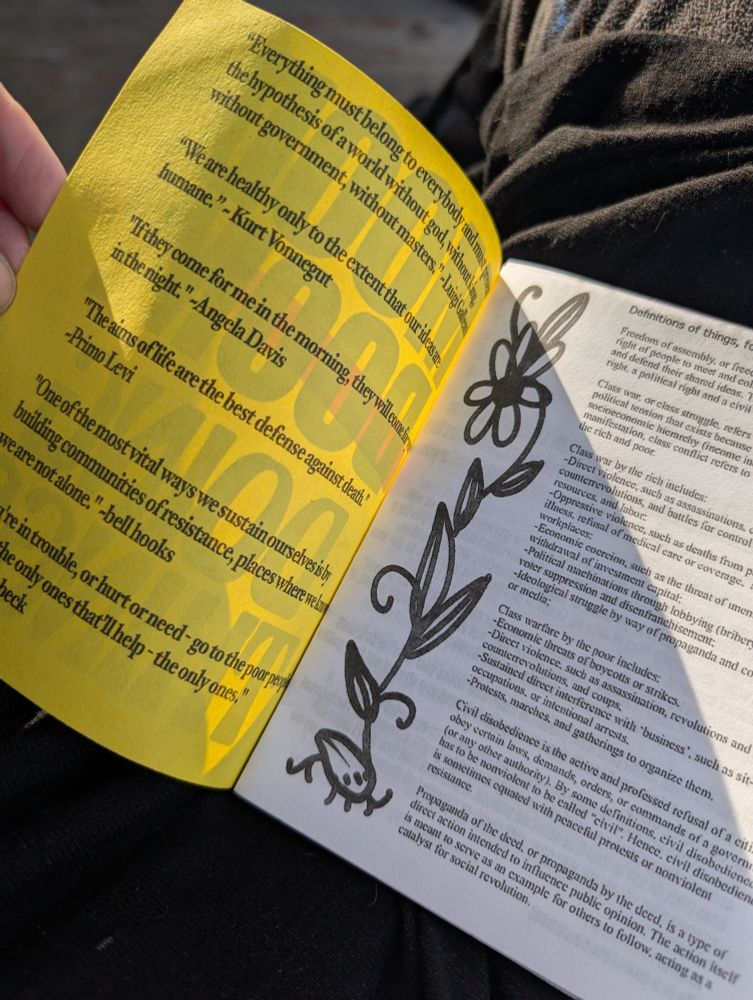a zine with a yellow cover with quotes and a drawing and "definitions of things"