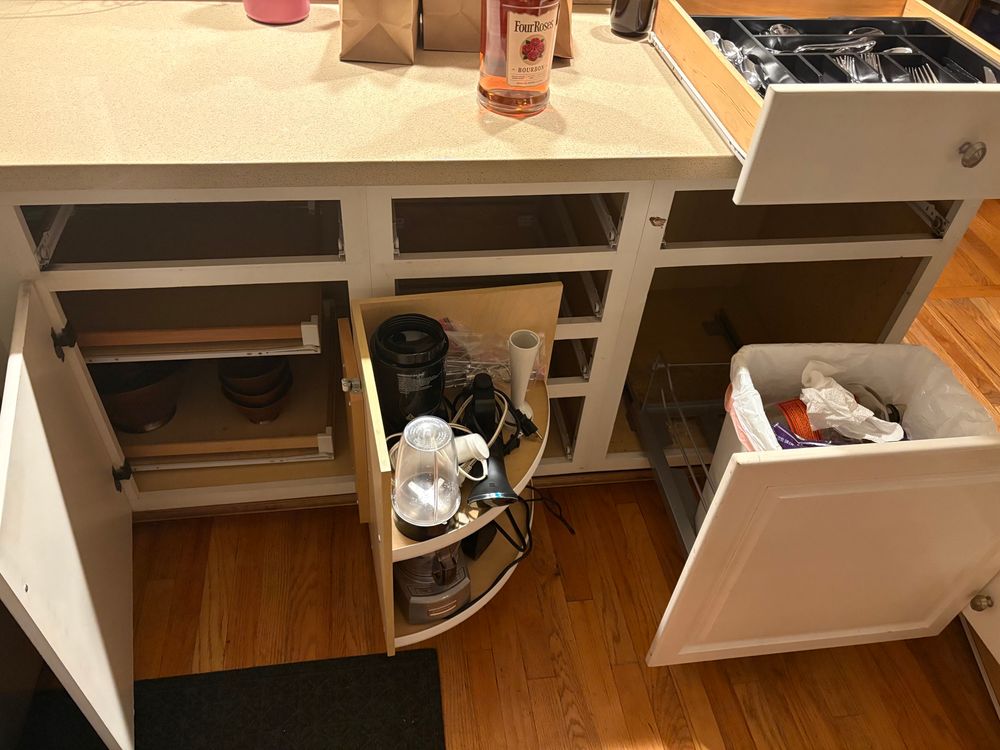 Open cabinets and drawers to find where a smell of death is coming from 