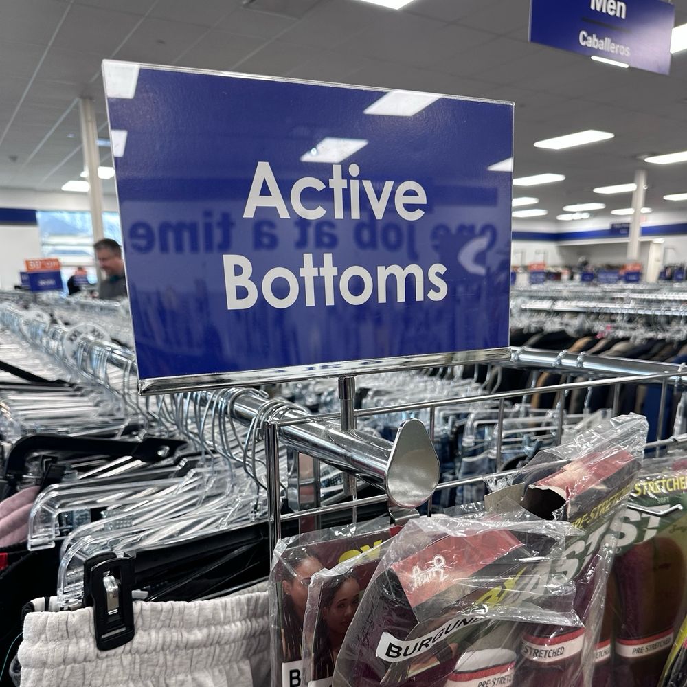 A sign with a blue background and white lettering that reads “Active Bottoms”
