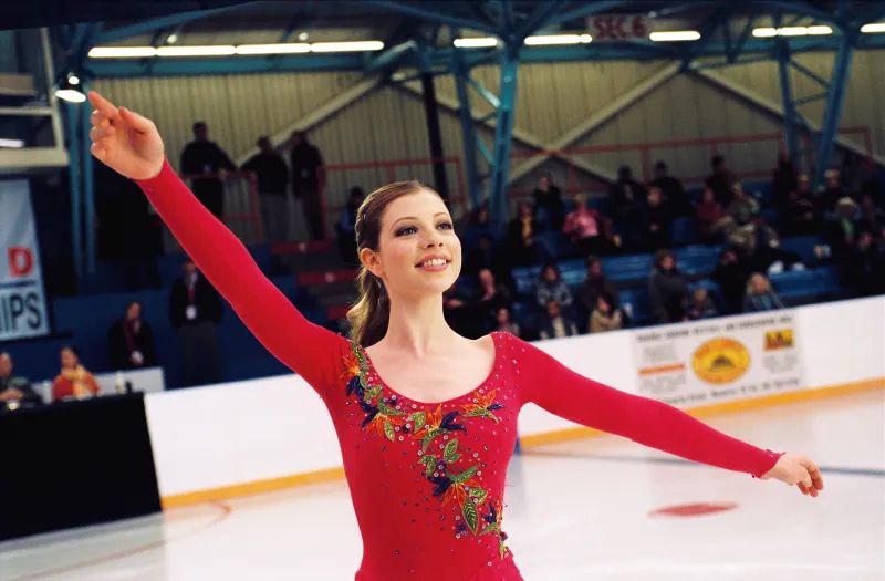 Photo of actress Michelle Trachtenberg in the movie Ice Princess, wearing a red figure skating costume 