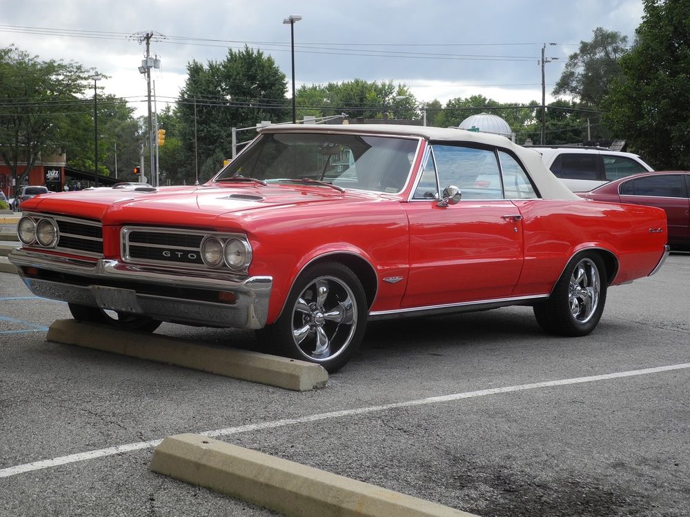 A red 1964 Pontiac GTO convertible