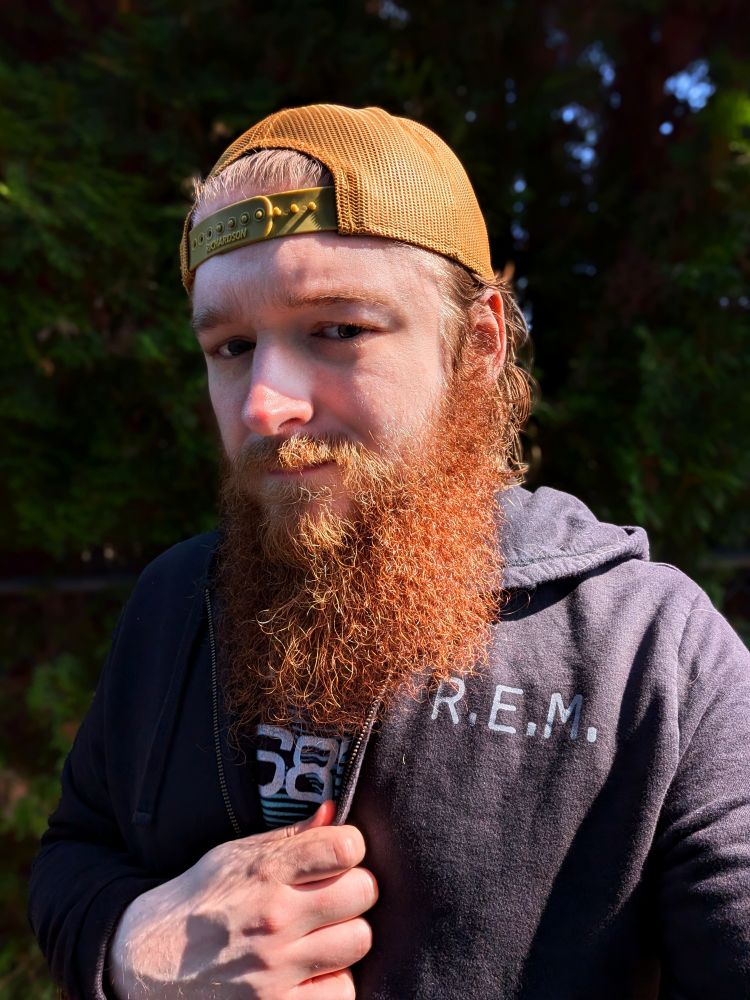 andrew wearing an R.E.M. New Adventures in HiFi hoodie